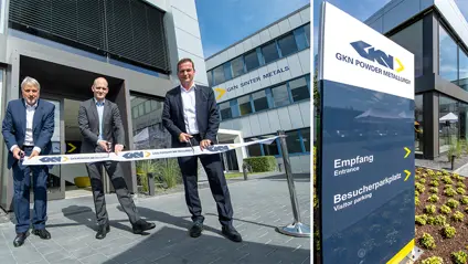 Customer Centre Bonn Opening. Three men cutting a GKN ribbon outside new GKN building