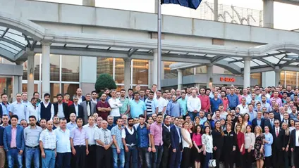 Team photo outside a GKNPM office
