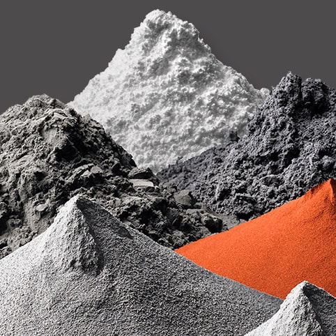 Piles of powder in grey, white and orange